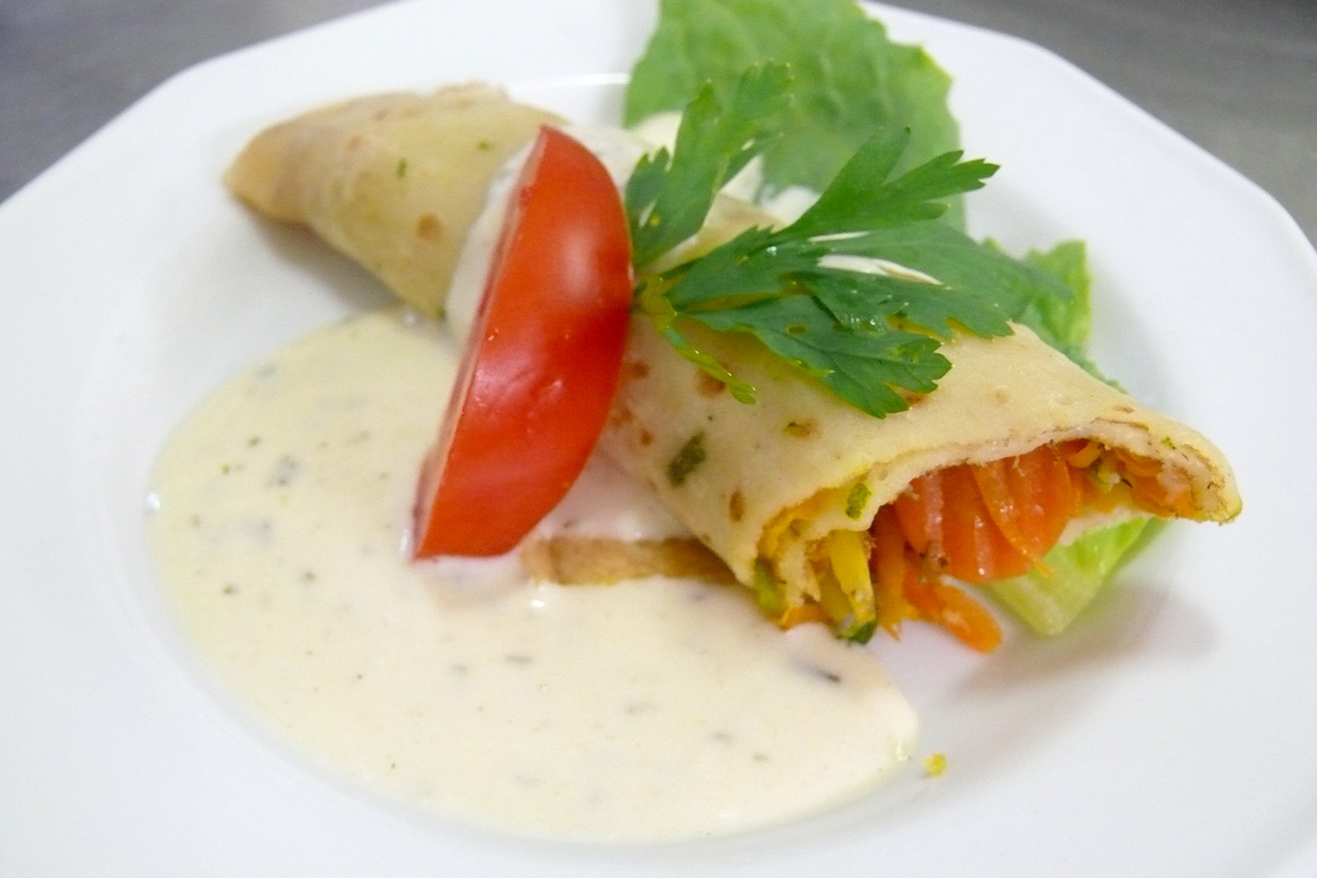 Vegetable pancake with cheese sauce