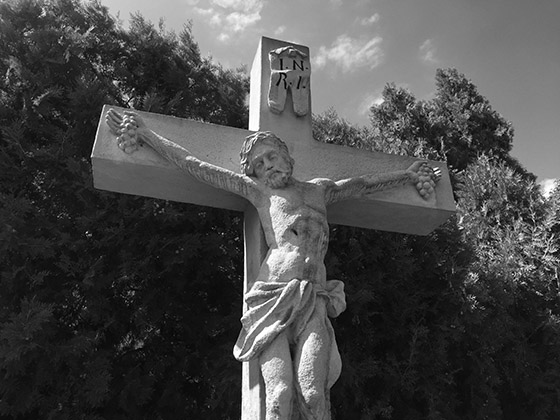 The baroque stone cross at the corner of Kada street and Sörgyár street